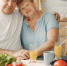 Beautiful old couple prepare food in a kitchen - Газета Новое Знамя